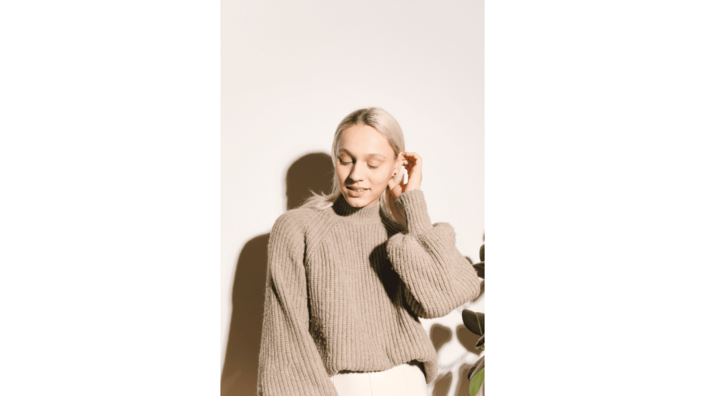 Woman wearing a cozy knitted turtleneck sweater