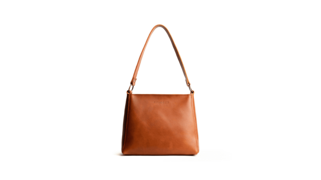 Almost Perfect' triangle shoulder bag in a structured neutral tone design