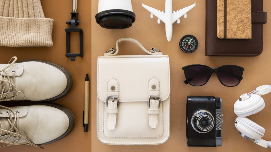 Top view of travel essentials neatly packed in a still life arrangement.