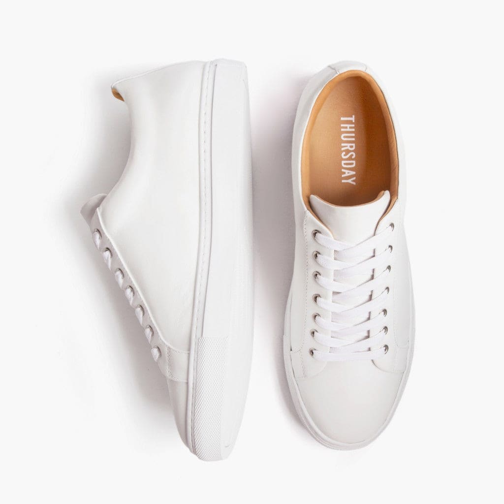 These are white low-top trainers designed for women, known as Women's Premier.
