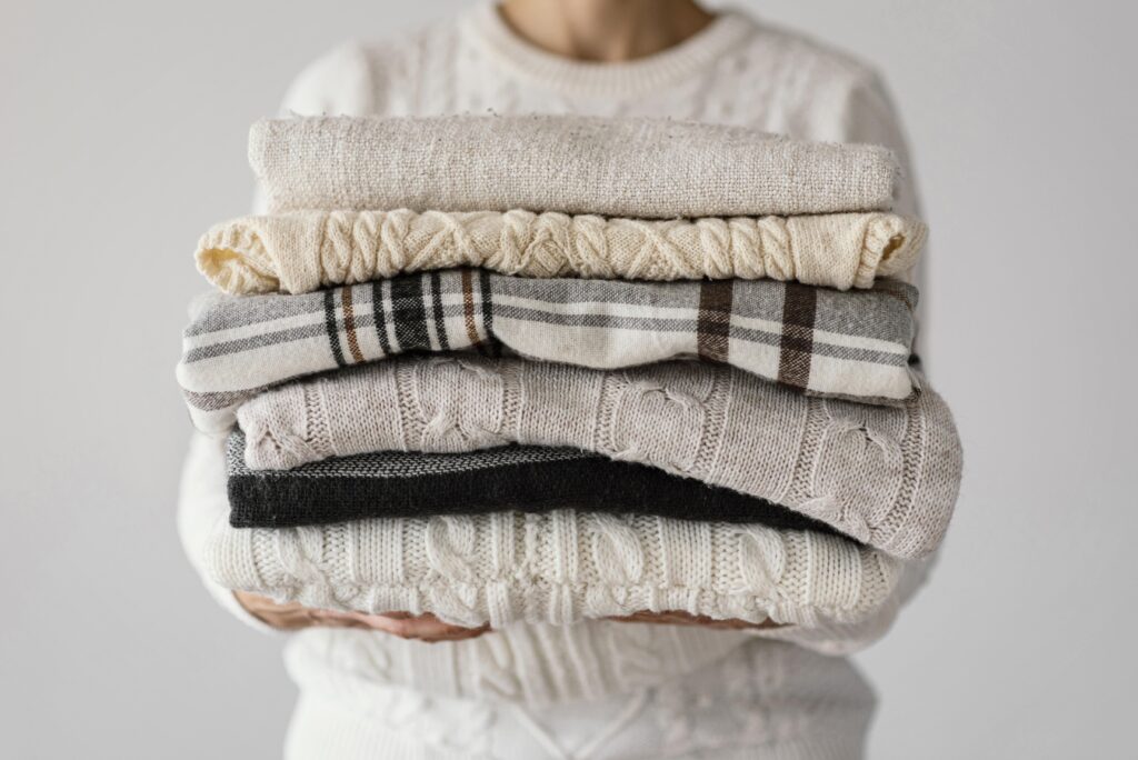Free image featuring a close-up of knitted blankets in a wardrobe