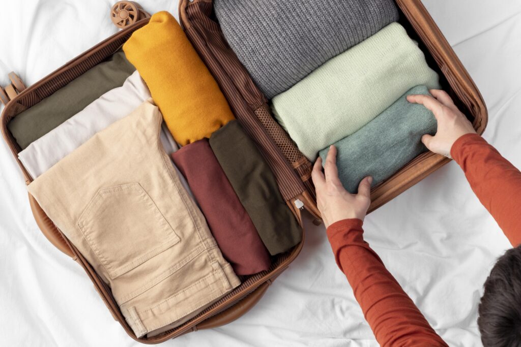 Opened luggage with folded clothes