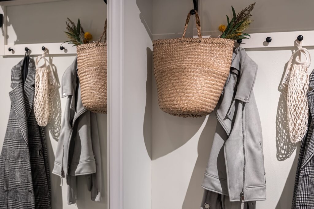 Place for outerwear in the hallway, hooks for hanging, home interior.