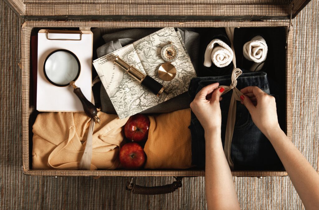 Top view vintage suitcase with casual clothes