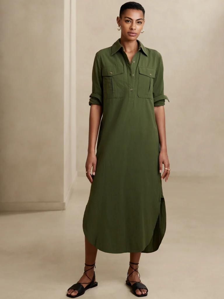Woman donned in a stylish green shirt dress.