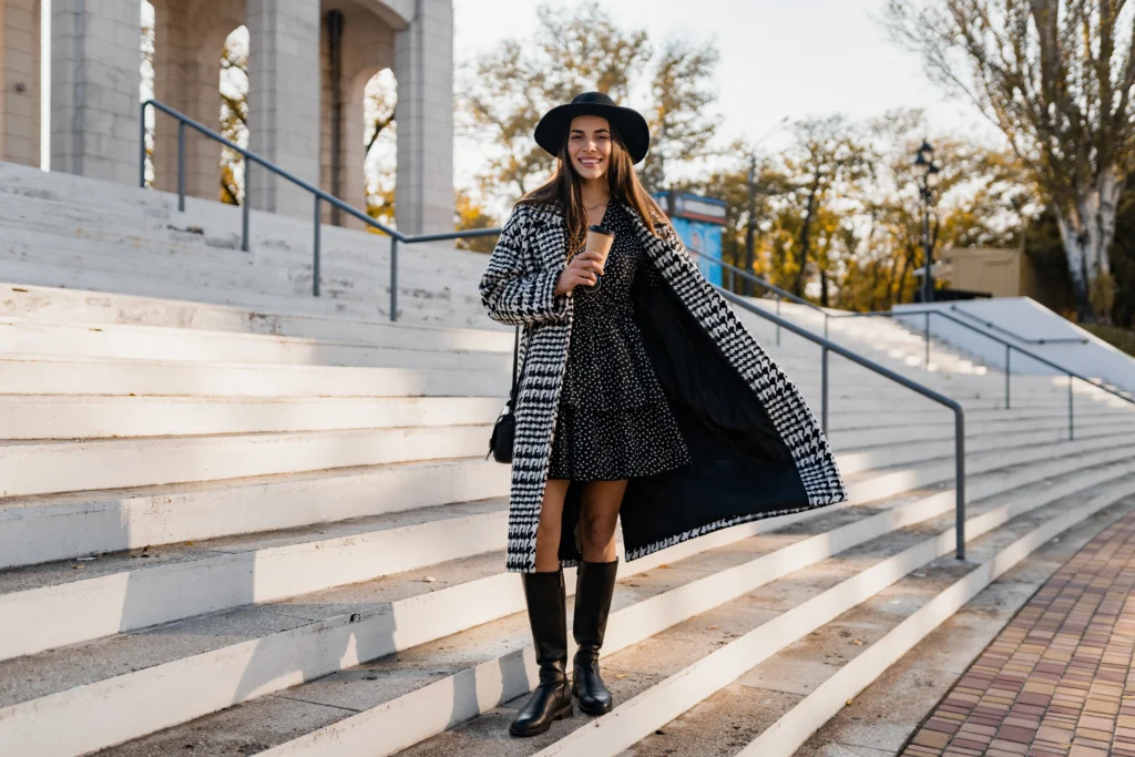 Attractive young woman walking in autumn wearing coat