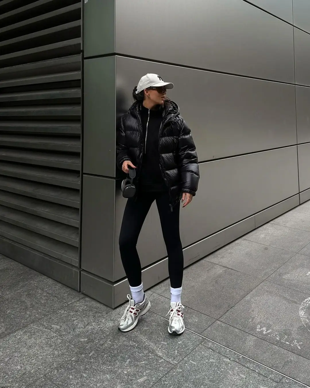 Influencer Nicole Russell showing off her athleisure outfit in all monotone