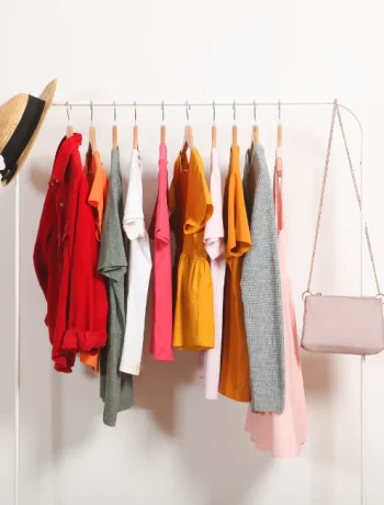 A neatly organized capsule wardrobe showcasing a reduced collection of clothing items, illustrating effective capsule wardrobe tips for creating a versatile and timeless style.