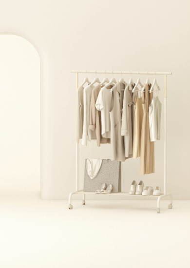 Minimalist aesthetic clothing hanging on a rack with an armchair, set against a pastel beige background in a creative 3D render composition.