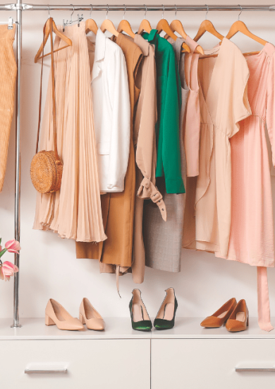 Modern wardrobe featuring stylish spring clothes and accessories, arranged using how to organize your closet tips